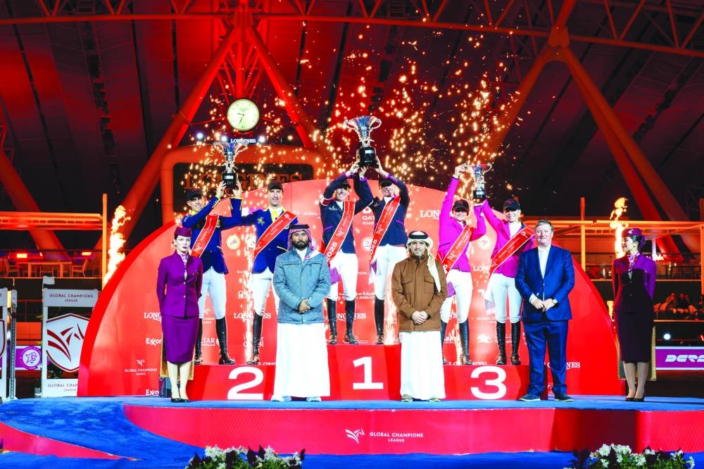 
Sophie Hinners and Janne Friederike Meyer-Zimmermann celebrate with the trophy after leading Cannes Stars to Global Champions League Doha title at Al Shaqab. The winners were crowned by Bader al-Darwish, Vice-Chairman of the Organising Committee of the Championship and President of the Qatar Equestrian Federation, Mohammed Jaber al-Khayarin, Event Director, and Jan Tops, President of the Longines Global Champions Tour. 