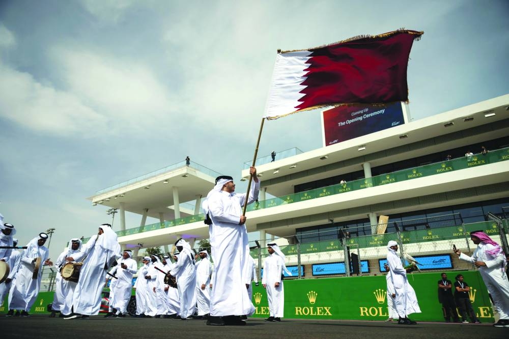 
High jump legend Mutaz Barshim at the grid walk at LIC yesterday. The opening ceremony of the Qatar 1812km commenced with the Qatar National Anthem, sung by a choir from Qatar Music Academy, and a traditional Qatari folk dance, Arda. 