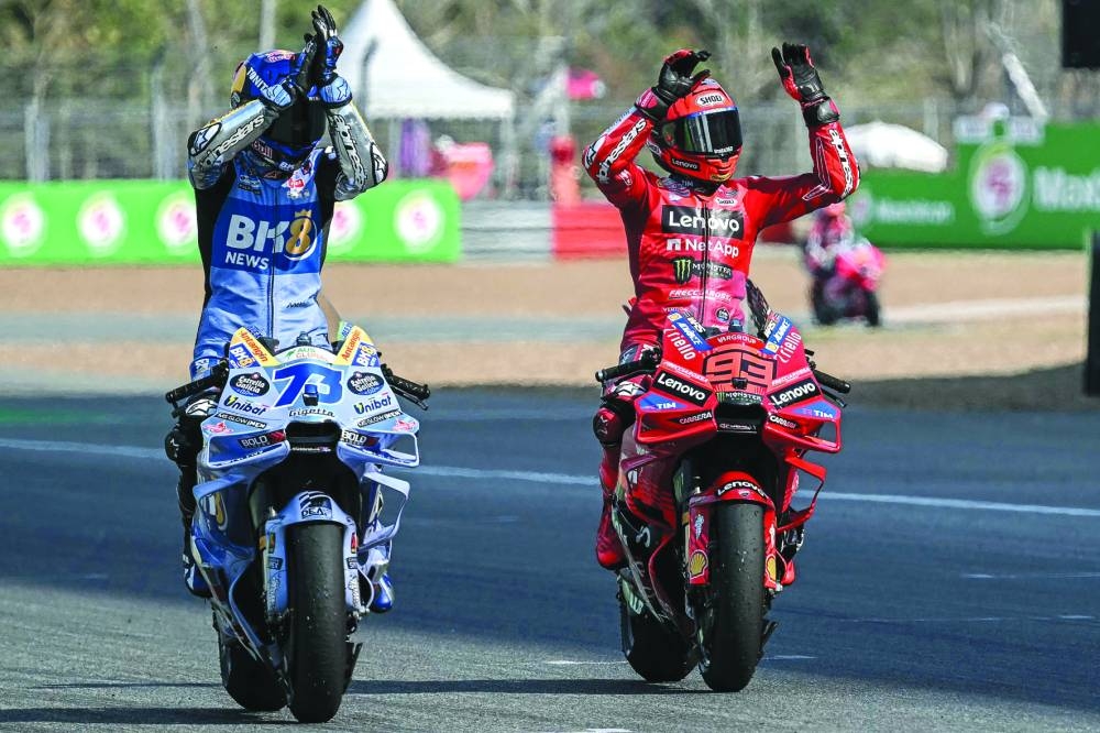 
Thailand MotoGP sprint winner Marc Marquez (right) of Spain celebrates with his brother and second-placed Alex Marquez of Gresini Racing at the Buriram International Circuit in yesterday. (AFP) 