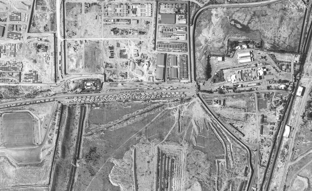 A satellite image shows trucks waiting on the Egyptian side of the Gaza-Egypt border crossing, in Rafah, Egypt, on Sunday. Maxar Technologies/Handout via REUTERS