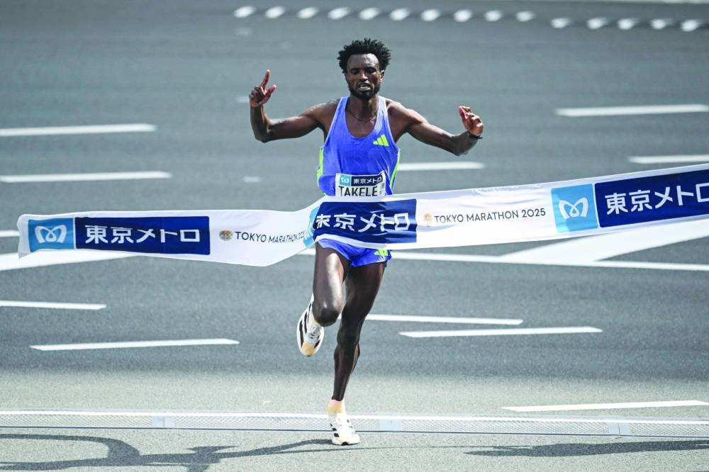 
Ethiopia’s Tadese Takele finishes in first place to win the men’s category of the Tokyo Marathon in Tokyo yesterday. (AFP) 