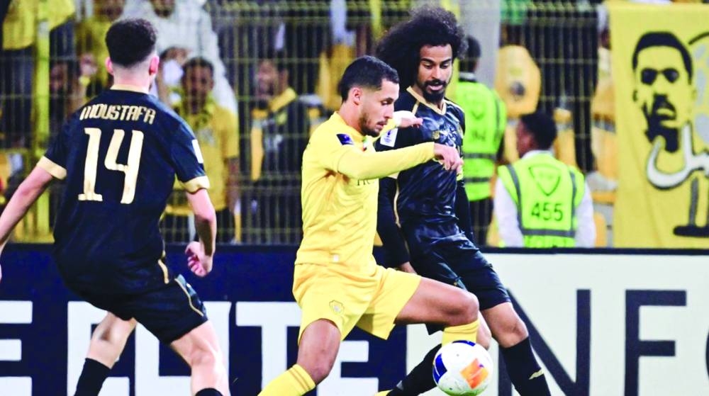 Al Sadd’s Akram Afif vying for the ball with a Al Wasl player during their AFC Champions League Elite 2024-25 Round of 16 first leg match at the Zabeel Stadium in Dubai on Monday.
