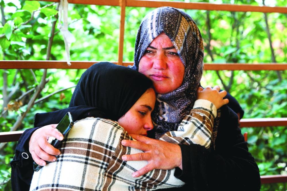 
Mourners react during the funeral of two Palestinians killed by Israeli fire in Rafah, amid impasse over the ceasefire deal, at Nasser hospital in Khan Younis, in the southern Gaza Strip, yesterday. 