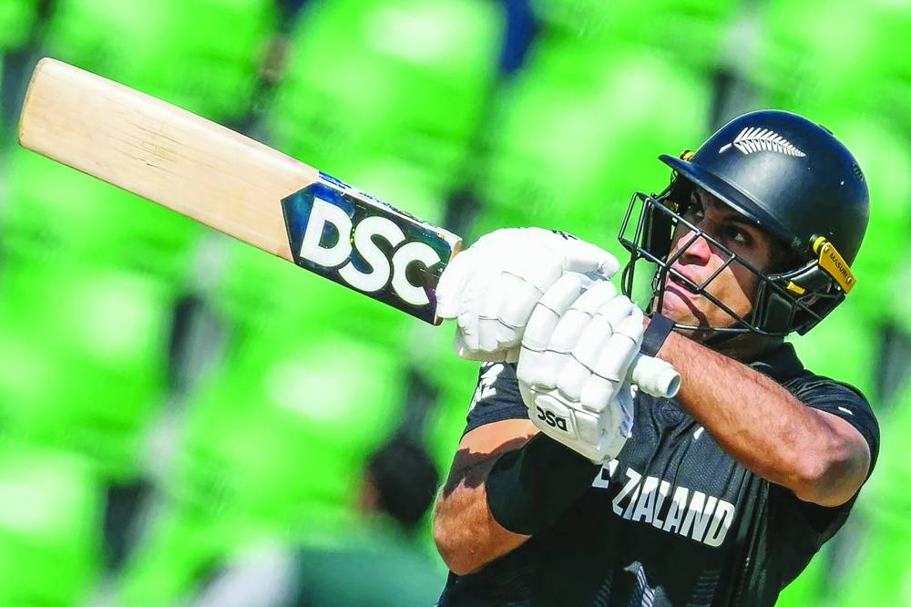 New Zealand’s Rachin Ravindra plays a shot during the ICC Champions Trophy match against South Africa at the Gaddafi Stadium in Lahore on Wednesday. (AFP)