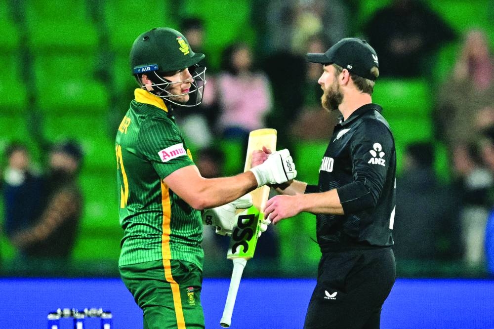 South Africa’s David Miller (left) is congratulated by New Zealand’s Kane Williamson for scoring a century on Wednesday. (AFP)