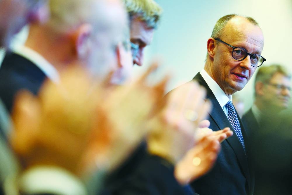 
Christian Democratic Union leader Friedrich Merz looks on as he is greeted with applause by the CDU and Christian Social Union members before the start of their parliamentary fraction meeting following the German general elections, in Berlin, last week. (Reuters) 