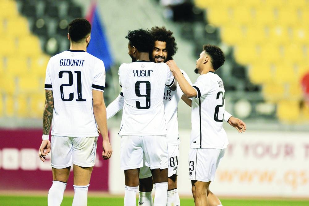 Al Sadd’s Akram Afif celebrates with teammates after scoring against Al Shahania on Friday.