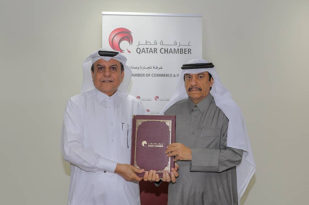 Qatar Chamber acting general manager Ali Bu Sherbak al-Mansouri and the Al Maraya Exhibition and Conferences CEO Jaber al-Mansouri at the chamber's Doha headquarters after signing the agreement at the chamber's headquarters.