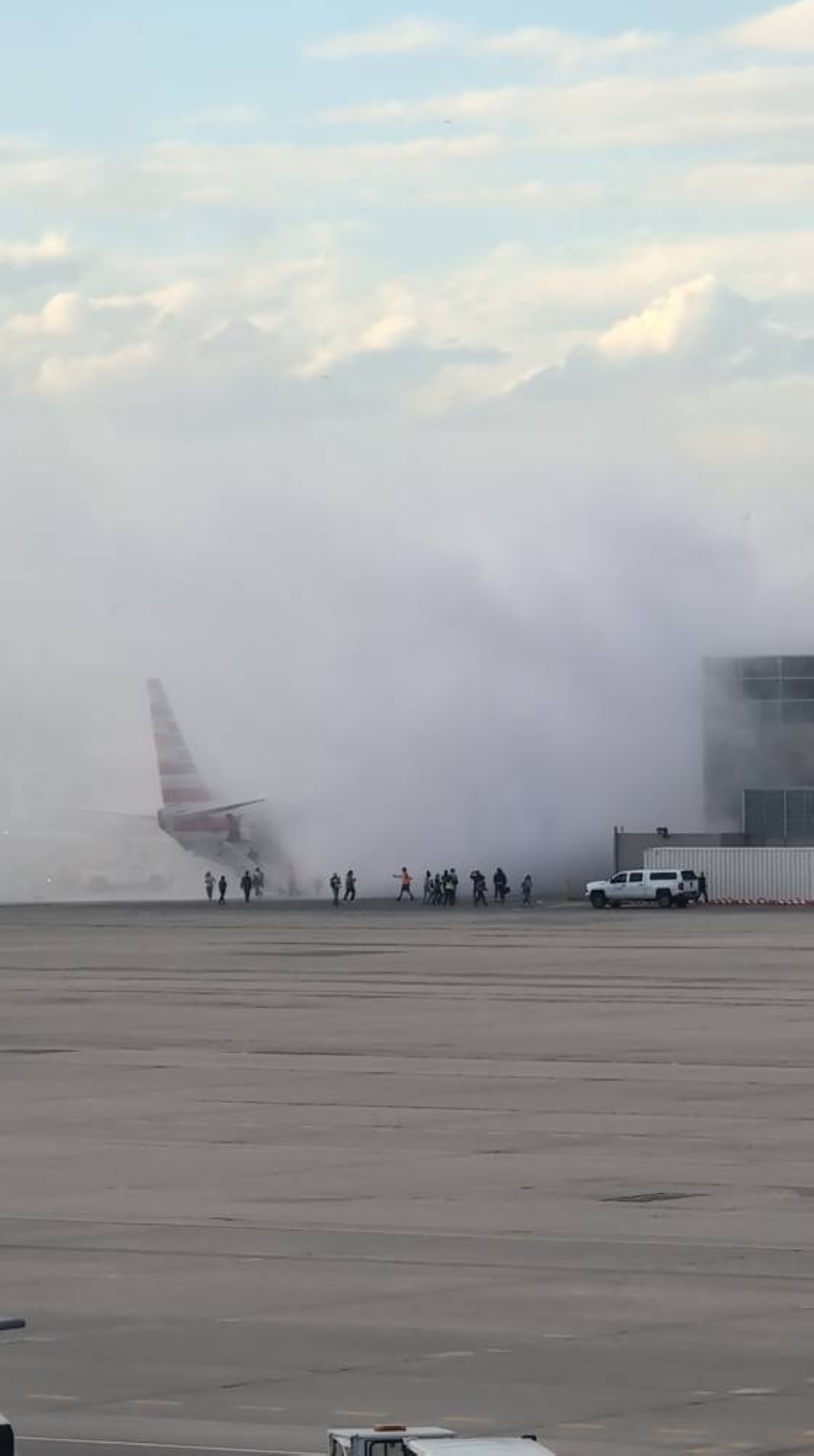Smoke rises as passengers get evacuated, after an American Airlines jet engine caught fire, in Denver, Colorado, US, on Friday in this screengrab obtained from a social media video. Aaron Clark/via REUTERS 