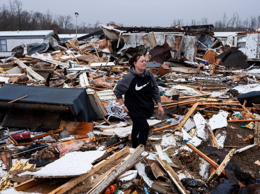 Stevie Kara searches for personal items after her home was destroyed on Saturday in Poplar Bluff, Missouri. AFP