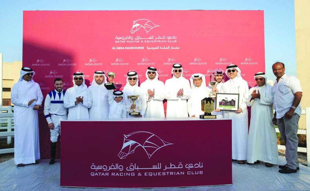 Connections of Gold Fleece celebrate after the mare won the The Late Yousef Al Romaihi Cup at Al Uqda Racecourse on Thursday.  PICTURES: Juhaim