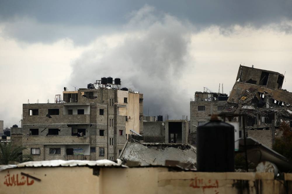 Smoke billows after an Israeli strike near the Bureij refugee camp in the central Gaza Strip on Friday. AFP