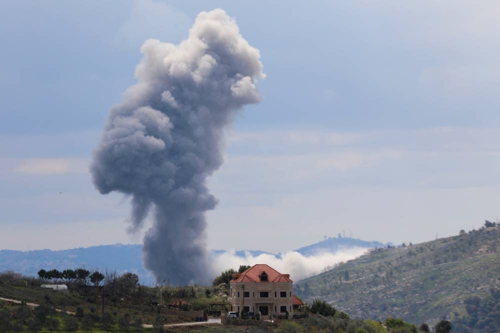Smoke rises from Taibeh, following Israeli strikes in response to cross-border rocket fire, as seen from Marjayoun in southern Lebanon, on Saturday. REUTERS