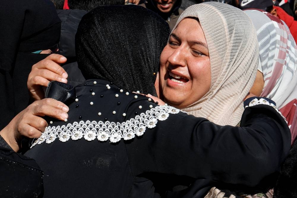 Women mourn Palestinians killed in Israeli strikes, at Nasser hospital in Khan Younis in the southern Gaza Strip, on Sunday. REUTERS