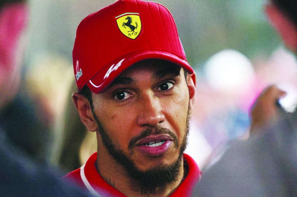 
Ferrari’s Lewis Hamilton is interviewed after finishing sixth place in the Chinese Grand Prix yesterday. (Reuters) 
