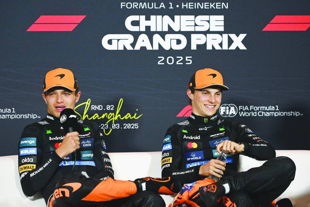 
McLaren’s British driver Lando Norris (left) and teammate Australia’s Oscar Piastri attend a press conference after the Chinese Grand Prix at the Shanghai International Circuit yesterday. (AFP) 