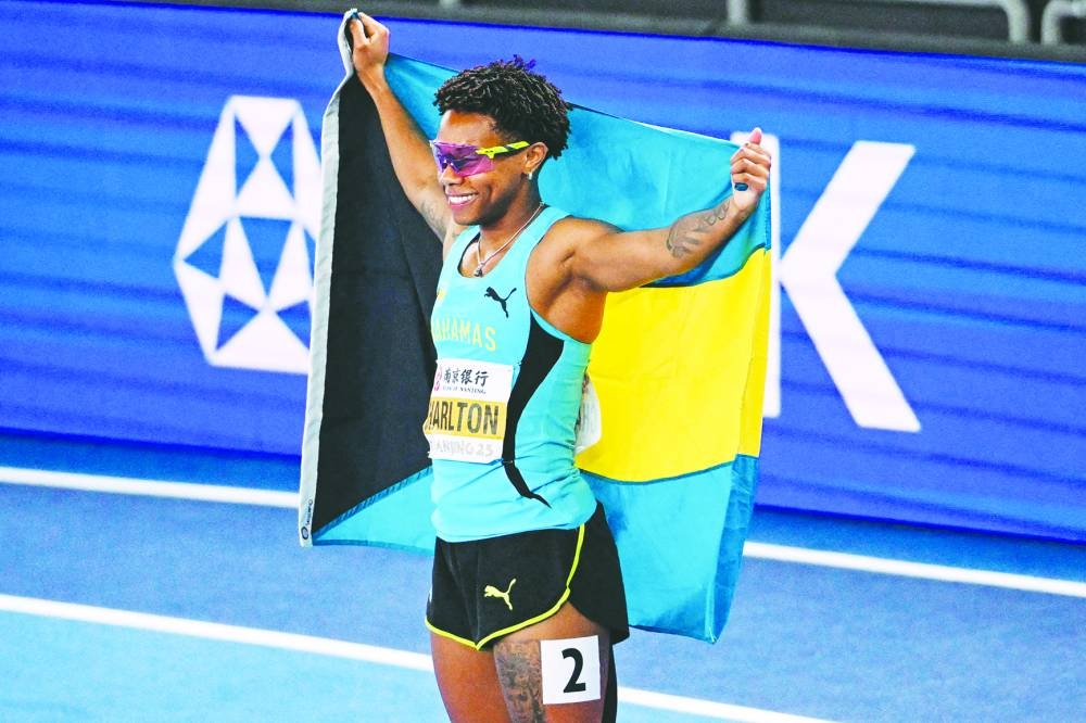 
Bahamas’s Devynne Charlton celebrates after winning the women’s 60m hurdles yesterday. (AFP) 
