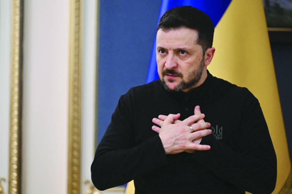 Ukrainian President Volodymyr Zelensky gestures as he speaks to journalists during his press conference in Kyiv Tuesday.