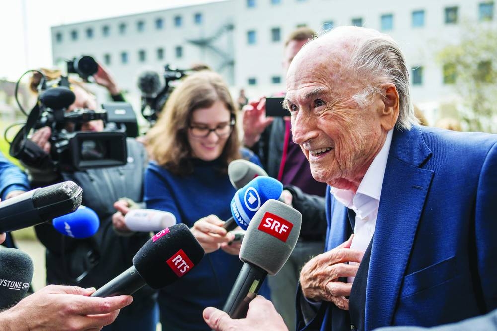 Former FIFA president Sepp Blatter addresses media as he leaves the courthouse after the verdict of an appeal by Swiss Attorney General’s office against former UEFA and FIFA presidents over a suspected fraudulent payment, in Muttenz near Basel, on Tuesday. (AFP)
