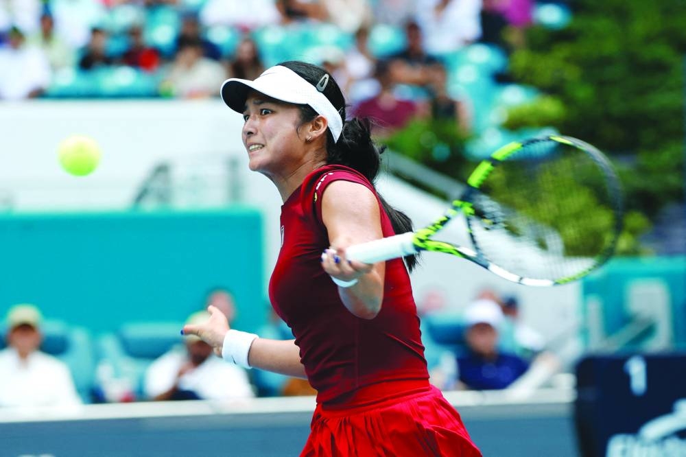 Alexandra Eala of the Philippines hits a forehand against Iga Swiatek of Poland on day nine of the Miami Open at Hard Rock Stadium.  (AFP)
