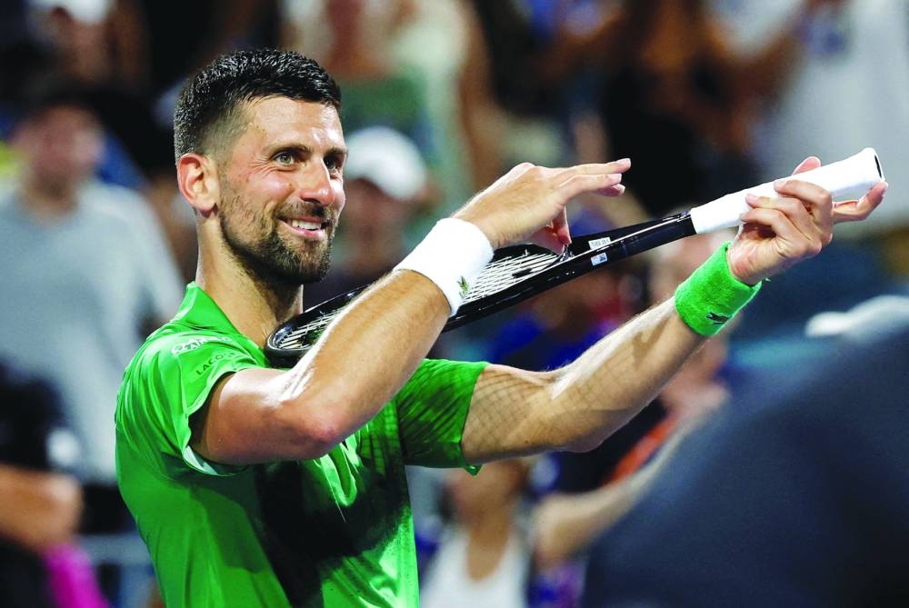 Novak Djokovic of Serbia celebrates after his match against Lorenzo Musetti of Italy on day eight of the Miami Open at Hard Rock Stadium. (Reuters)