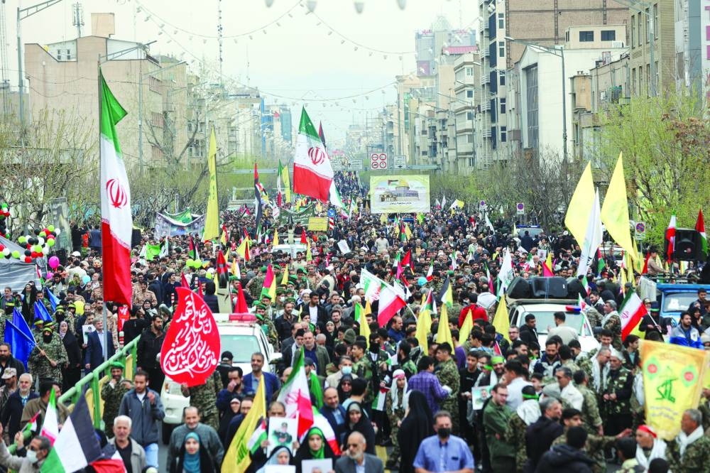 Iranians take part in a protest marking the annual Quds Day (Jerusalem Day) on the last Friday of the holy month of Ramadan in Tehran, yesterday.