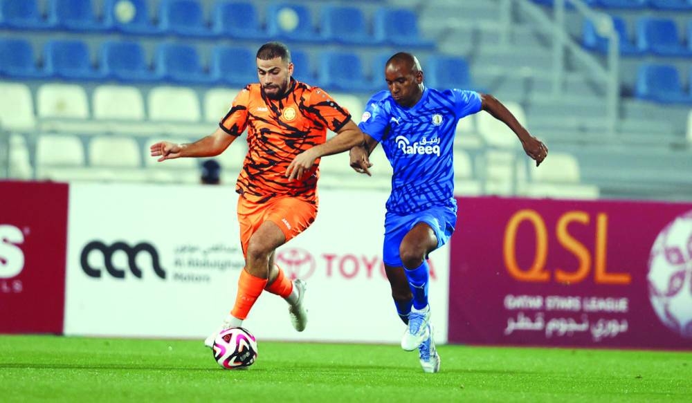Al Khor and Umm Salal players vying for the ball during their Qatar Stars League match at the Al Khor Stadium on Friday.