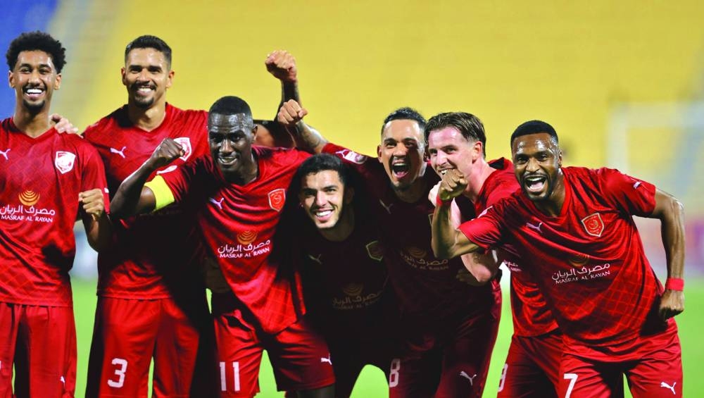 Al Duhail players celebrate after defeating Al Gharafa 2-0 in their QSL match at the Thani Bin Jassim Stadium on Saturday.