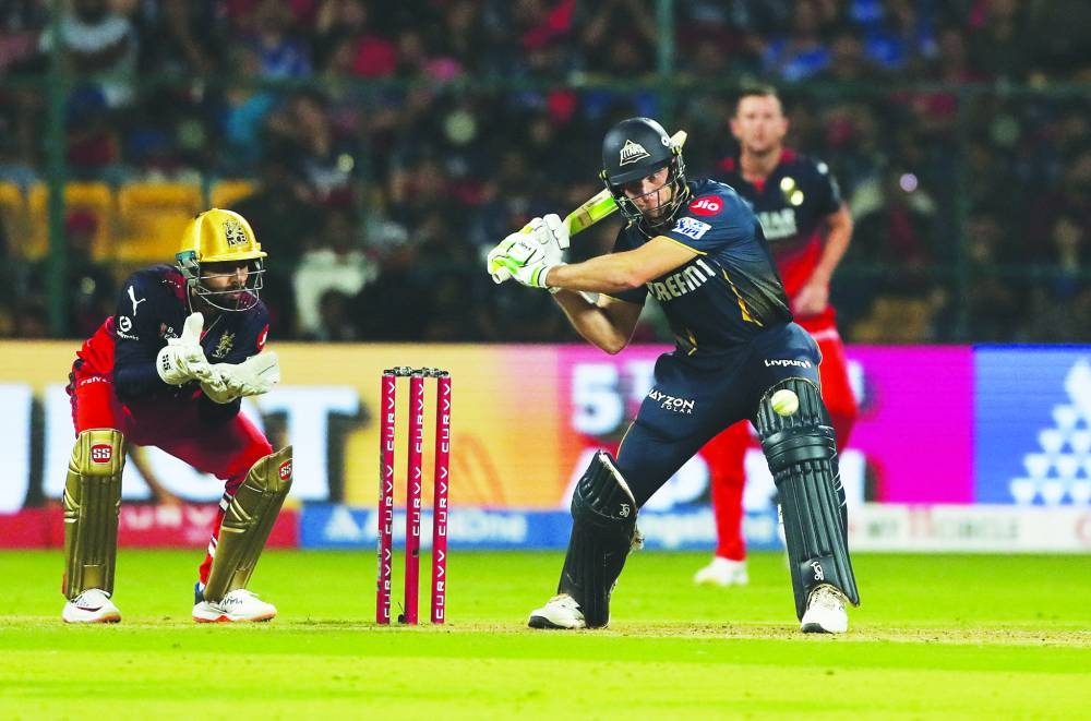 
Gujarat Titans’ Jos Buttler in action against Royal Challengers Bengaluru during their IPL match in M Chinnaswamy Stadium, Bengaluru, India, yesterday. (Reuters) 