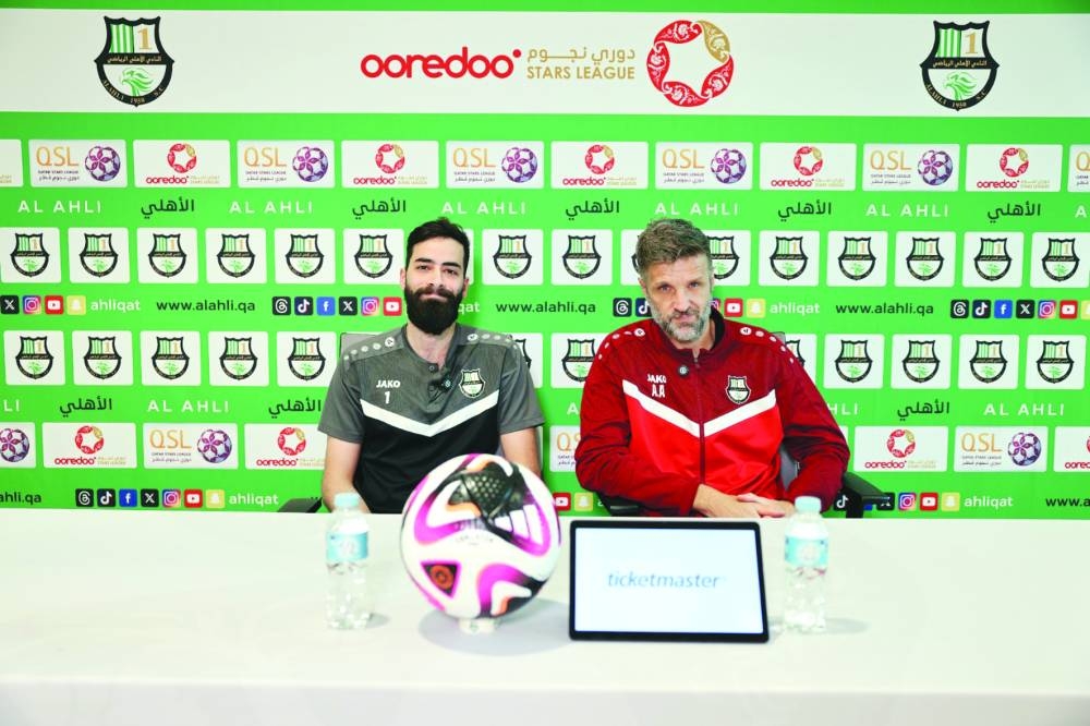 Al Ahli coach Igor Biscan and goalkeeper Yazan Naim pose during a press conference on Thursday. Al Ahli will take on Al Shahania in their Qatar Stars League match on Friday.