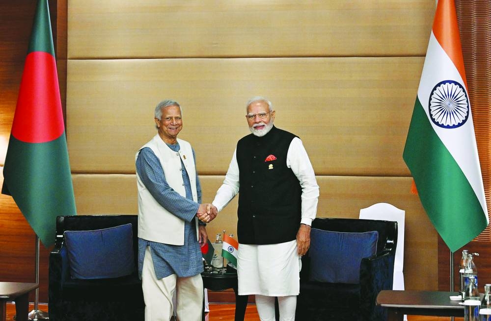 India’s Prime Minister Narendra Modi (right) shakes hands with de facto Bangladeshi leader and Nobel laureate Muhammad Yunus during their bilateral meeting on sidelines of the BIMSTEC Summit in Bangkok, Thailand, on Friday.