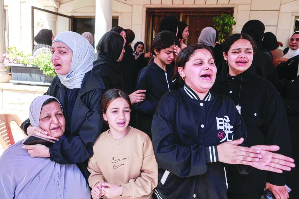 Relatives of 42-year-old Palestinian Hussein Hardan mourn during his funeral in Jenin in the occupied West Bank, yesterday.