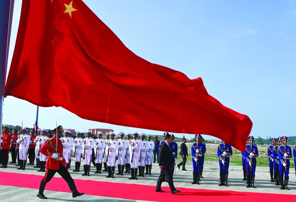 Cambodia's Prime Minister Hun Manet walks past honour guards during the inauguration ceremony of the modernised infrastructure at the Ream Naval Base in Preah Sihanouk province yesterday.