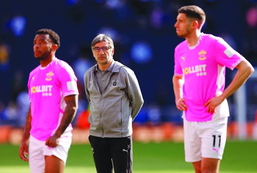 
Southampton manager Ivan Juric (centre) looks on after the club were relegated from Premier League after their loss to Tottenham Hotspur. (Reuters) 