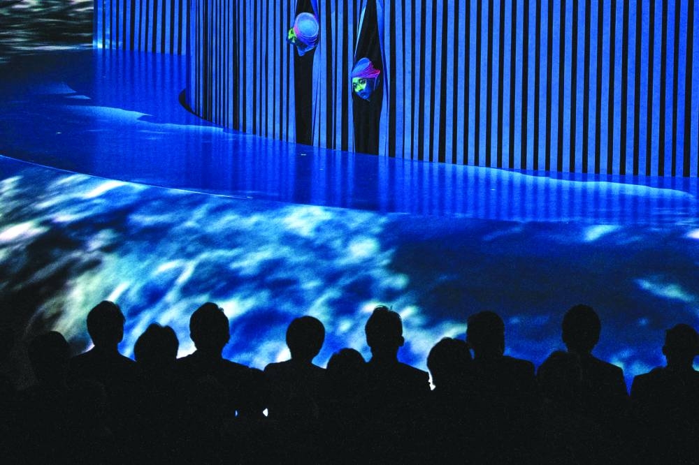 Dancers perform on stage during the official opening ceremony.