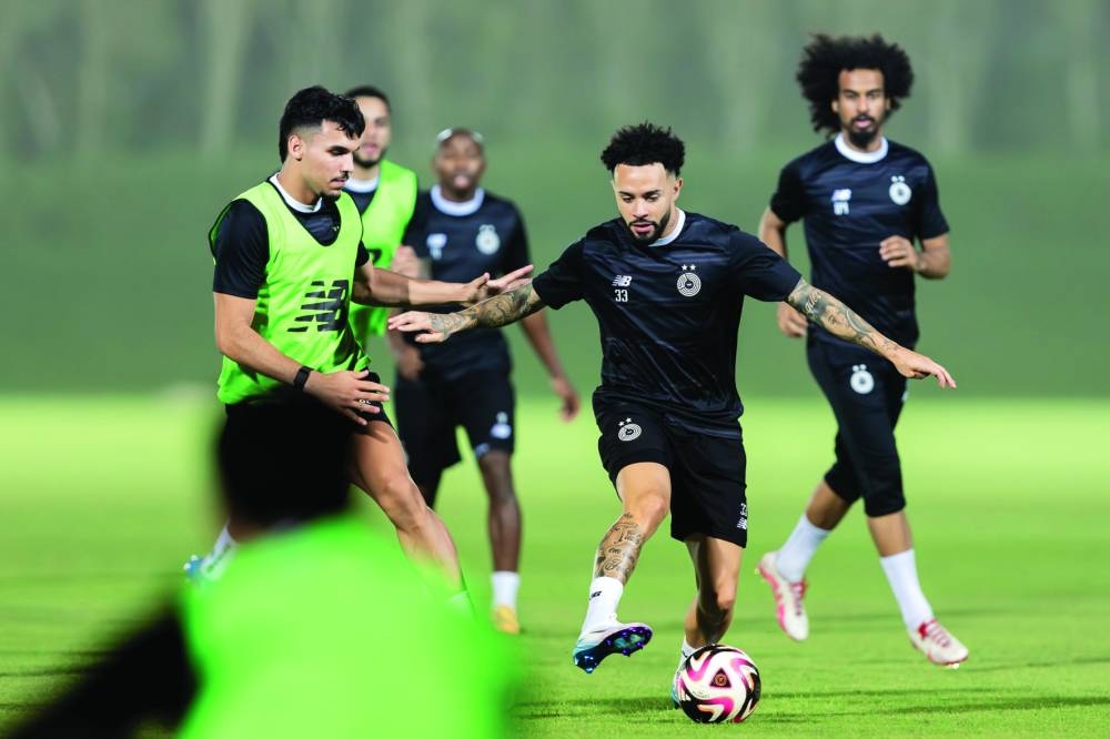 
Al Sadd players train on the eve of their Qatar Stars League match against Al Ahli.  
