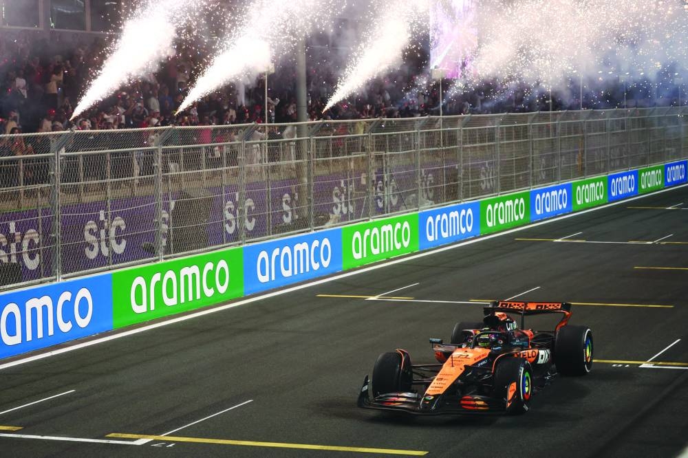 McLaren’s Oscar Piastri passes fireworks after winning the Saudi Arabian Grand Prix at Jeddah Corniche Circuit on Sunday. (Reuters)