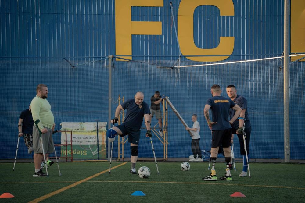 Ukrainian veterans and civilians with amputated limbs attend a training session of the football team “Unbreakable” in Kharkiv, on Tuesday 