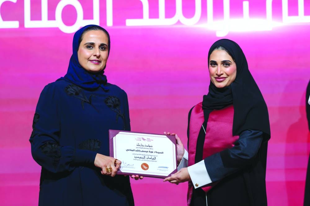 HE Sheikha Al Mayassa honouring a graduate.