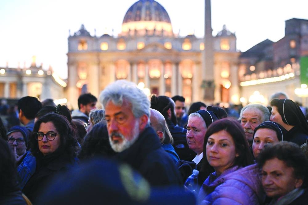 
Faithful queue to enter to pay respects to Pope Francis as he lies in state in St. Peter’s Basilica, as seen from Rome, Italy, yesterday. (Reuters) 
