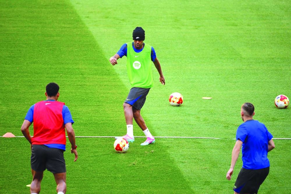 Barcelona’s Spanish forward Lamine Yamal controls the ball during a training session in Seville on Friday. (AFP)