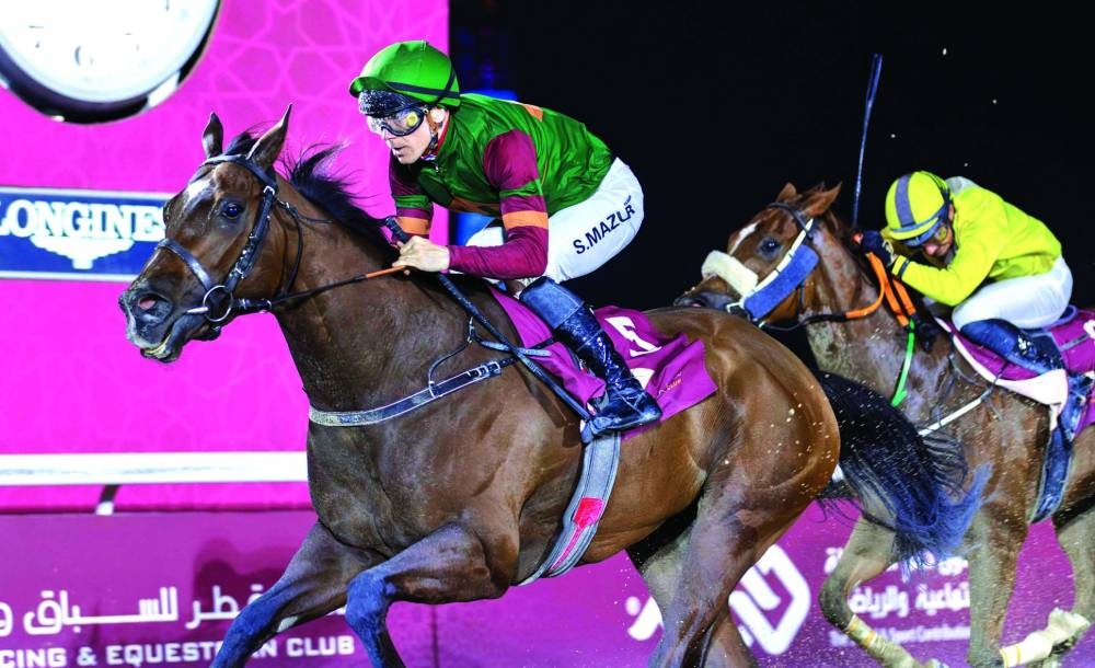Szczepan Mazur rides five-year-old mare Kimnkate to Al Ghariyah Cup win at Al Rayyan Racecourse on Saturday. PICTURES: Juhaim