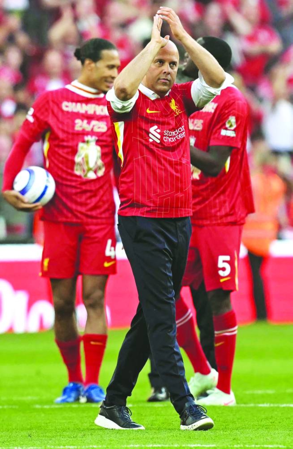 Liverpool’s Dutch manager Arne Slot celebrates after winning the Premier League match against Tottenham Hotspur at Anfield in Liverpool on Sunday. (AFP)