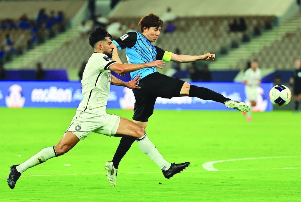 Kawasaki Frontale’s Yasuto Wakizaka and Al Sadd’s Tarek Salman vying for the ball during the Asian Champions League quarter-final at Prince Abdullah Al-Faisal Sports City Stadium in Jeddah on Sunday. (Reuters)
