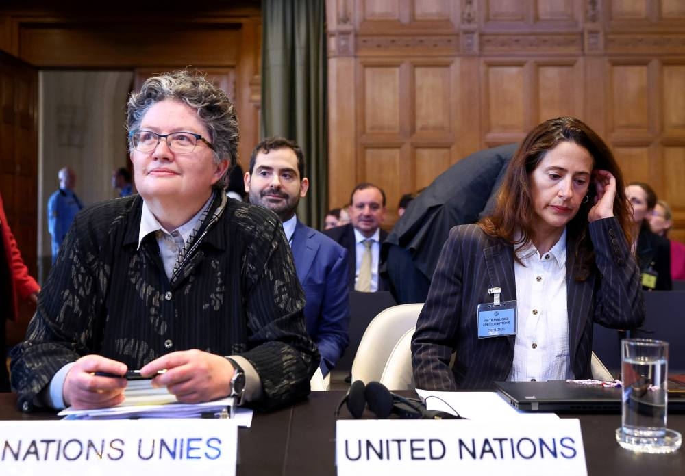 Elinor Hammarskjold, United Nations under-secretary-general for legal affairs and UN legal counsel, and Ana Peyro Llopis, acting special adviser and head of UNITAD, sit on the day of a hearing at The International Court of Justice (ICJ) in the ongoing case regarding Israel's occupation of Palestinian territories, in The Hague, Netherlands, on Monday. REUTERS