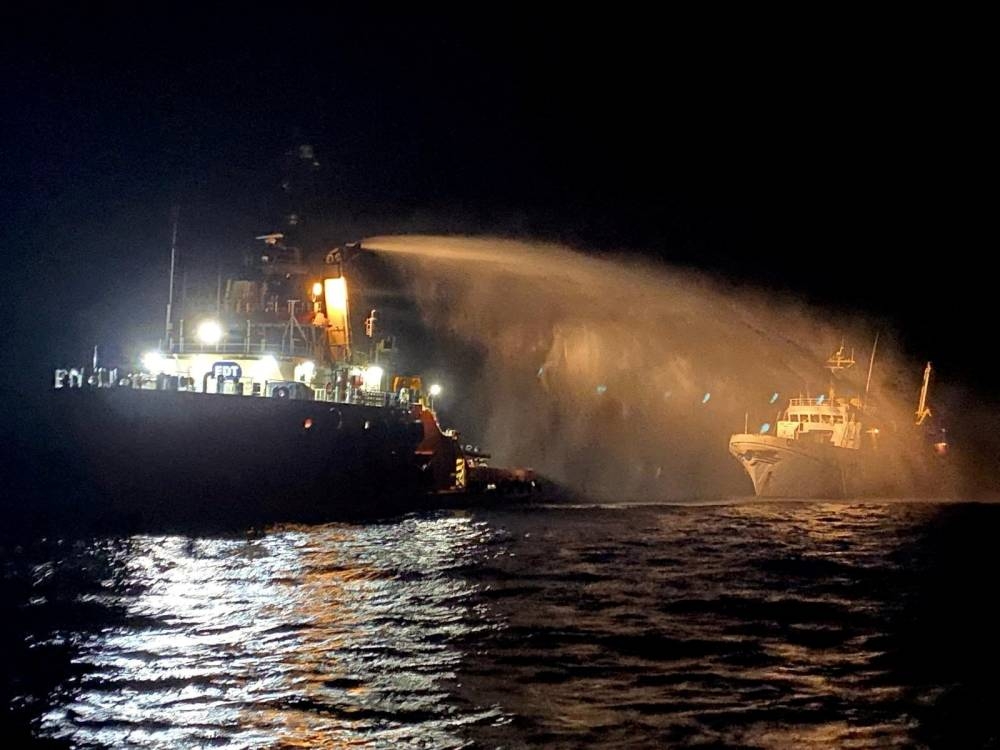 A tug vessel puts out a fire on the Gaza Freedom Flotilla vessel Conscience outside Maltese territorial waters in this handout picture provided by Malta Government Department of Information, on Friday.  Government of Malta/Handout via REUTERS