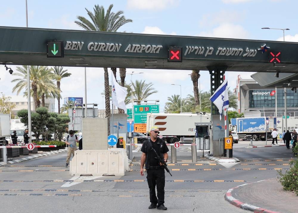 A security personnel stands at the entrance of Ben Gurion Airport following a missile attack launched from Yemen, in Tel Aviv, on Sunday. REUTERS