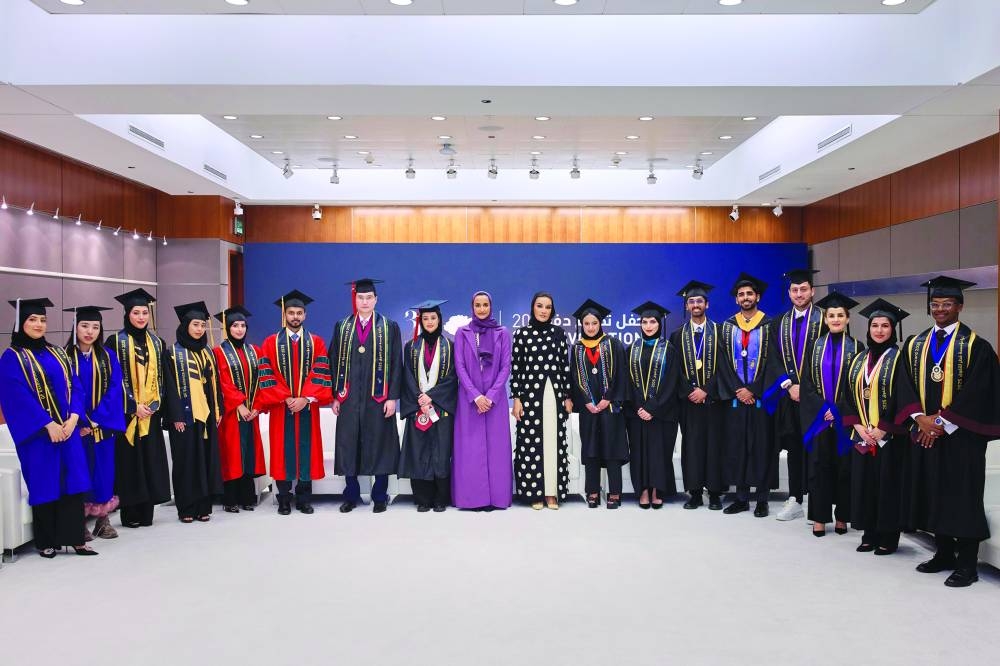 Her Highness Sheikha Moza bint Nasser and HE Sheikha Hind bint Hamad al-Thani with 16 members of the Class of 2025 who received the QF Excellence Award. PICTURES: AR Al-Baker.