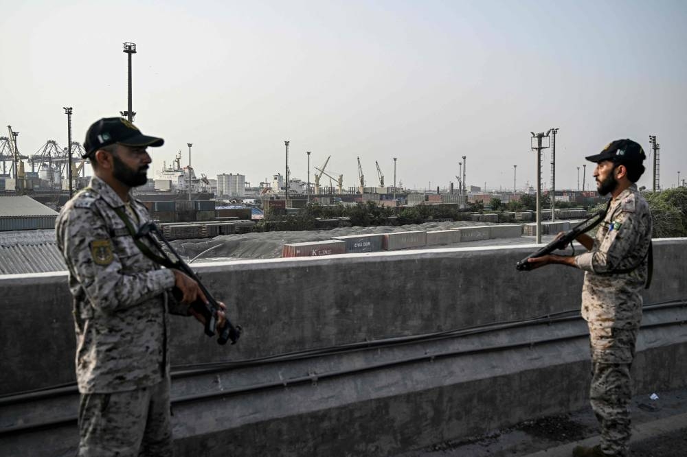 Security personnel stands guard near the Karachi Port in Karachi on Friday. AFP