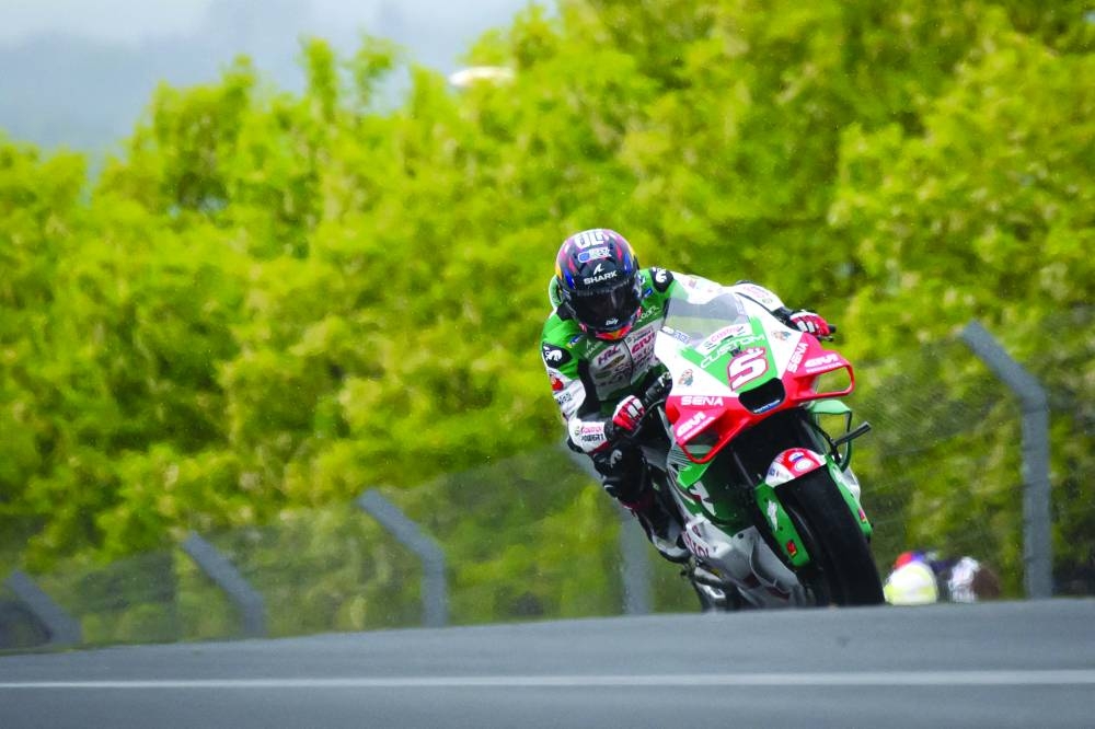 LCR Honda team’s French rider Johann Zarco (also inset) rides to win the French MotoGP at the Le Mans Circuit Sunday. AFP